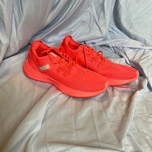 Pink puma running shoes